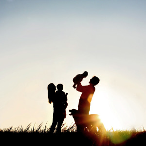 Family of Four on Sunset walk with a golden retriever