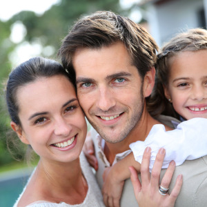 Family of three smiling