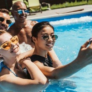friends laughing in pool